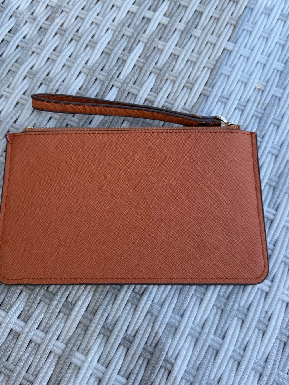 kate spade wristlet clutch in rust orange